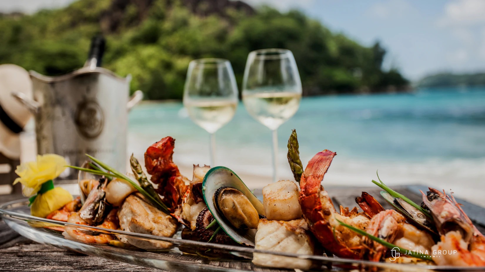 Miami chefs competing live in the VIP Chef Showdown at the South Beach Seafood Festival 2026, plating lobster and stone crab dishes on Ocean Drive at night