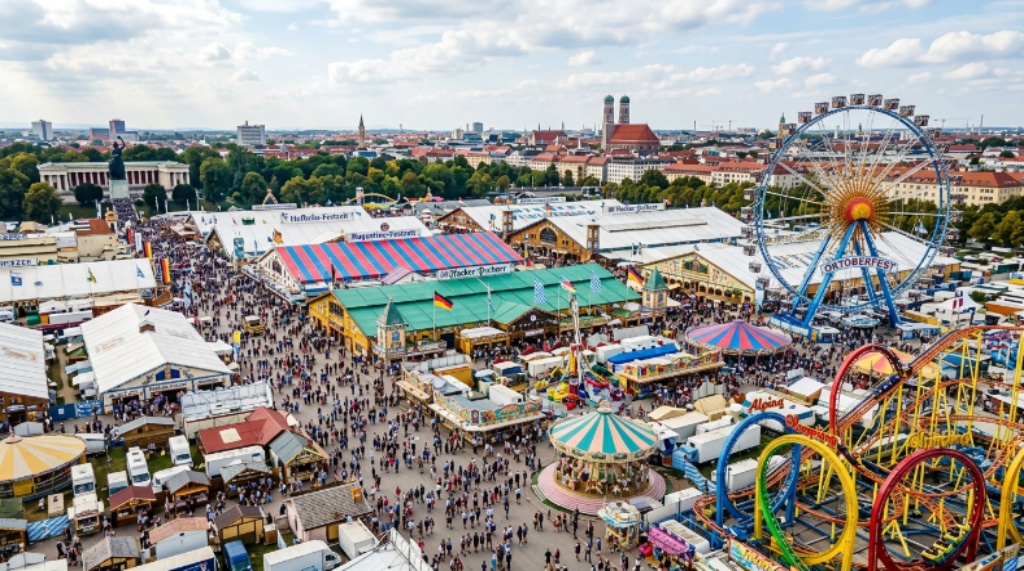 Aerial view of the Theresienwiese festival grounds during Oktoberfest Munich with colourful tents and fairground rides