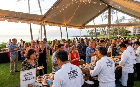 World-class chefs serving locally sourced Hawaiian dishes to guests at an oceanfront grand tasting event during the Hawaii Food and Wine Festival 2026 at Sheraton Maui Resort in Kaananapali