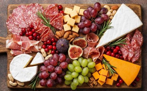 christmas charcuterie board with meats cheese and fruit