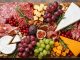 christmas charcuterie board with meats cheese and fruit